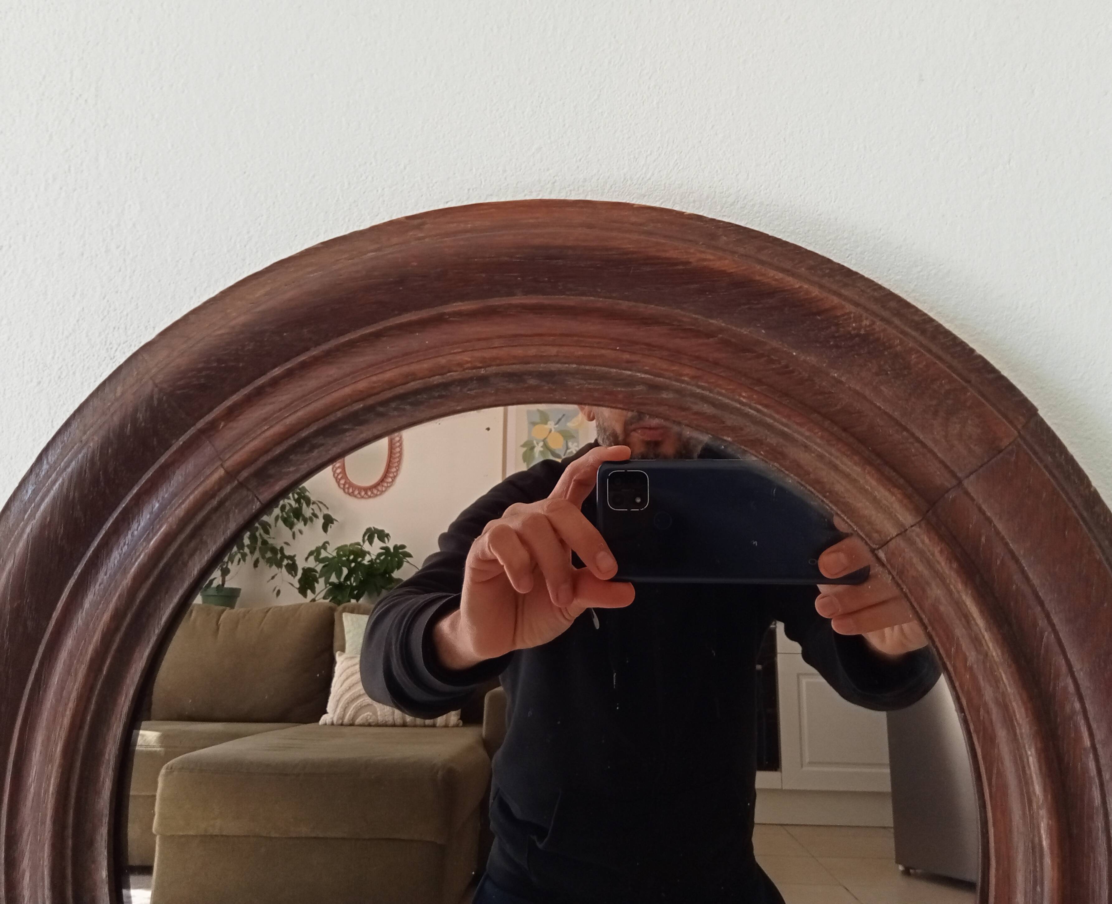 Antique round wooden mirror