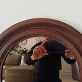 Antique round wooden mirror