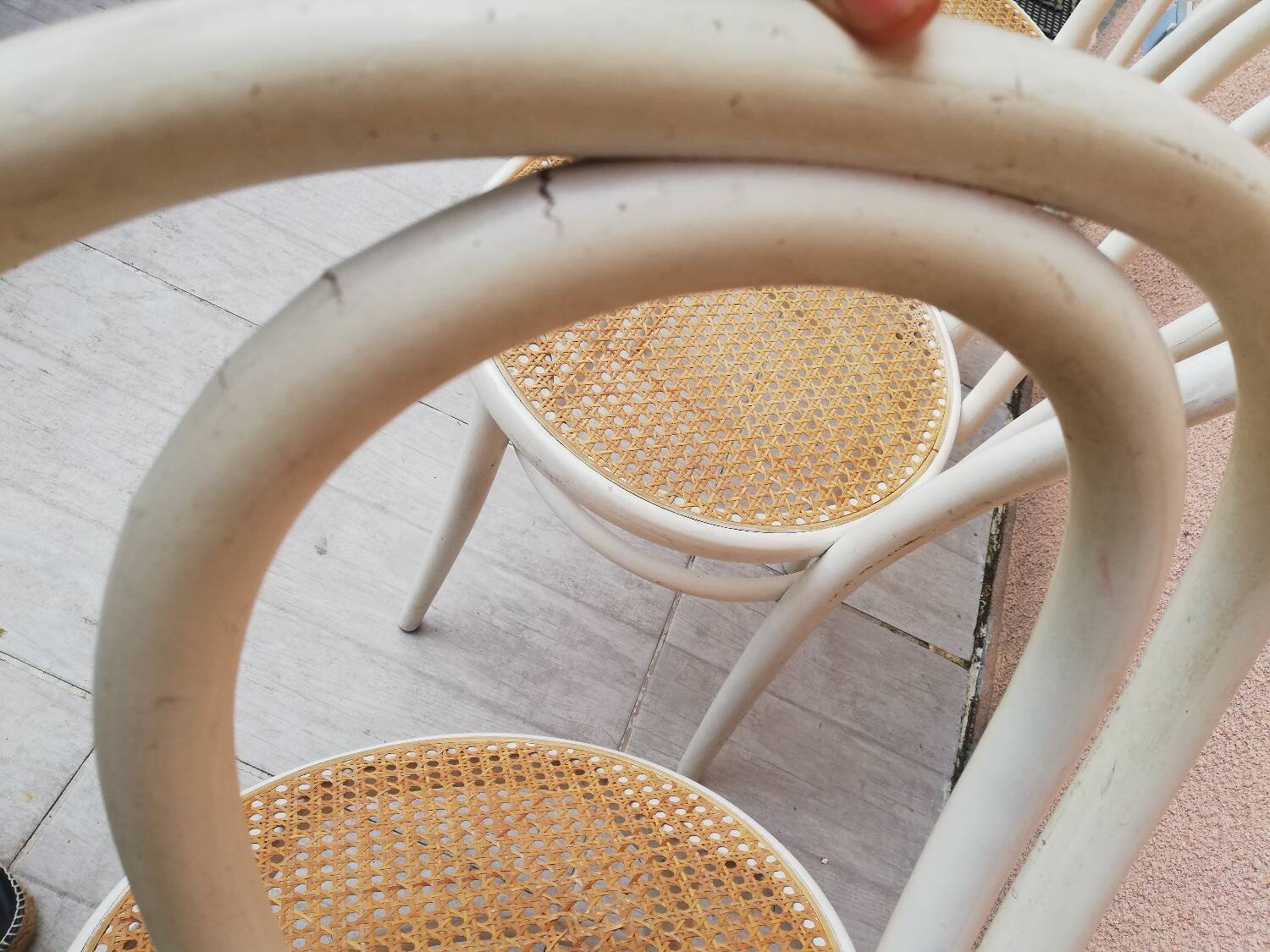 Lot of three Vintage ecru natural cane bistro chairs