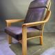 Chocolate leather armchair, wooden structure