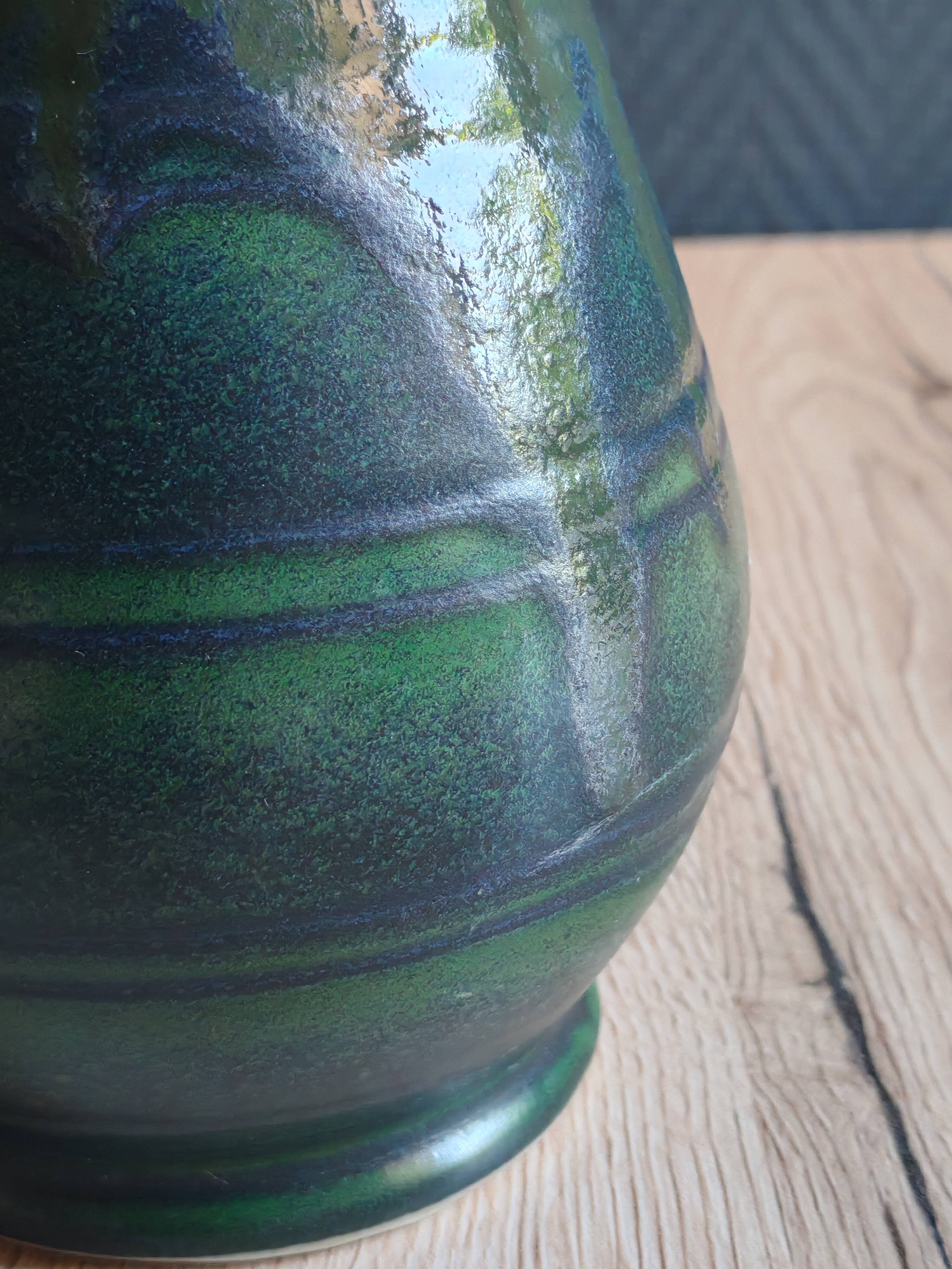 Vintage ceramic pitcher vase in glazed green and blue.