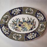 Ceramic dish decorated with peacock folk art Asian motif