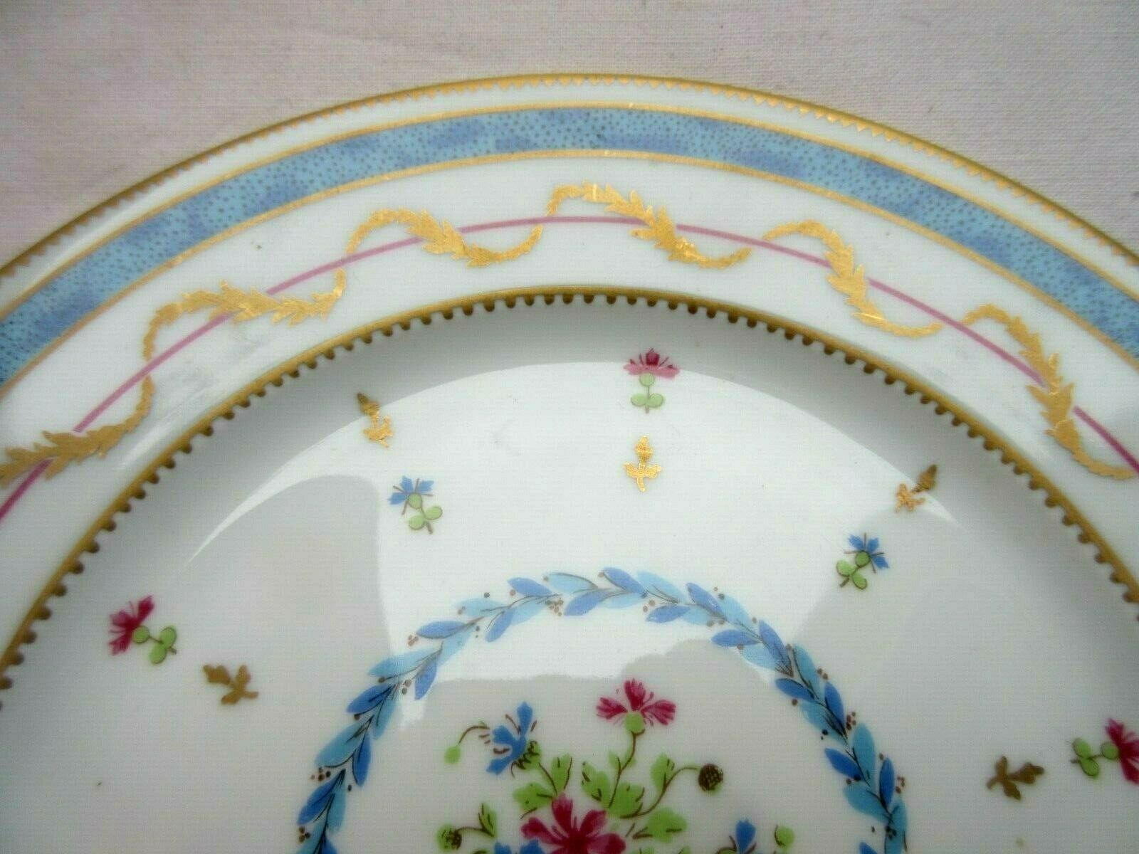 Assiette en porcelaine de Limoges pour Haviland bleue et or