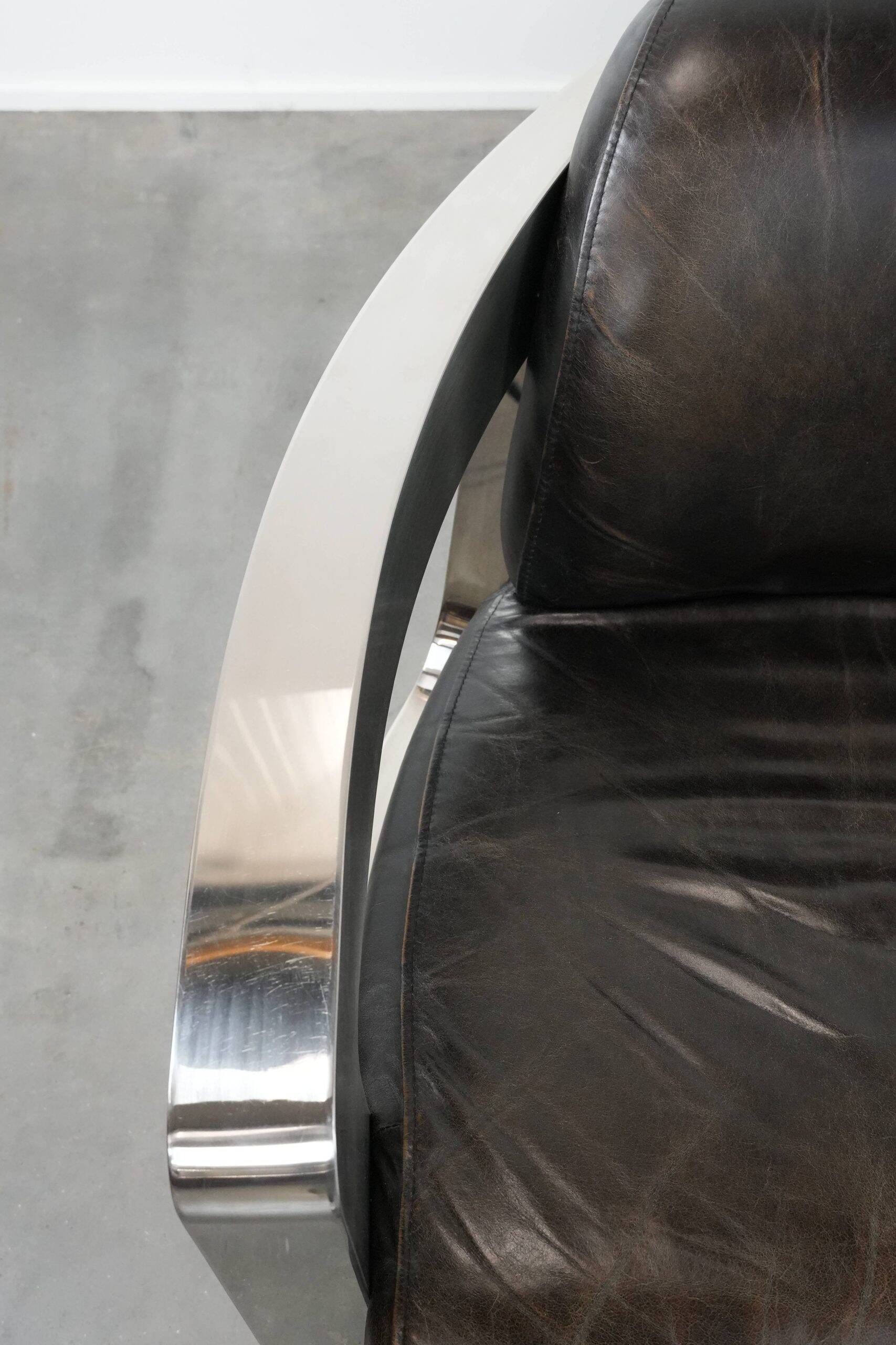 Set of two cowhide leather Aviator design armchairs with aluminium