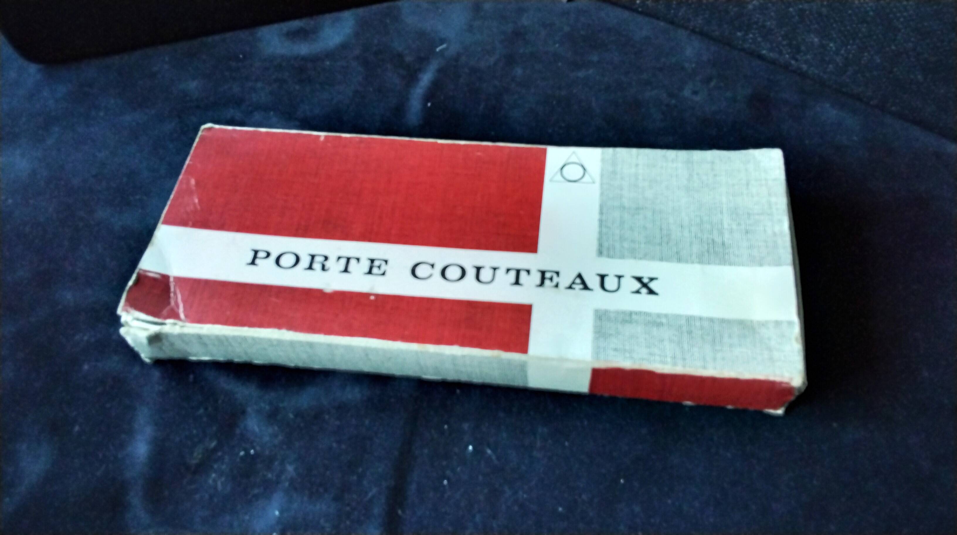 Set of 12 lead crystal knife rests in a triangular shape.