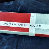 Set of 12 lead crystal knife rests in a triangular shape.