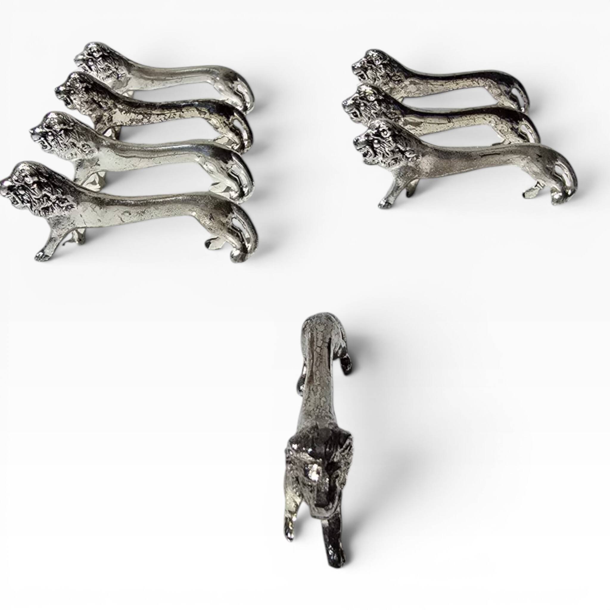 Series of antique knife rests in the shape of a lion, silver-plated metal.