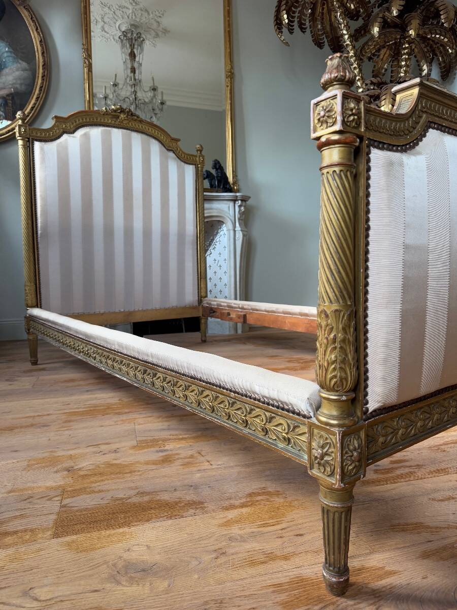 Pair of late 19th-century gilded wooden beds in Louis XVI style.