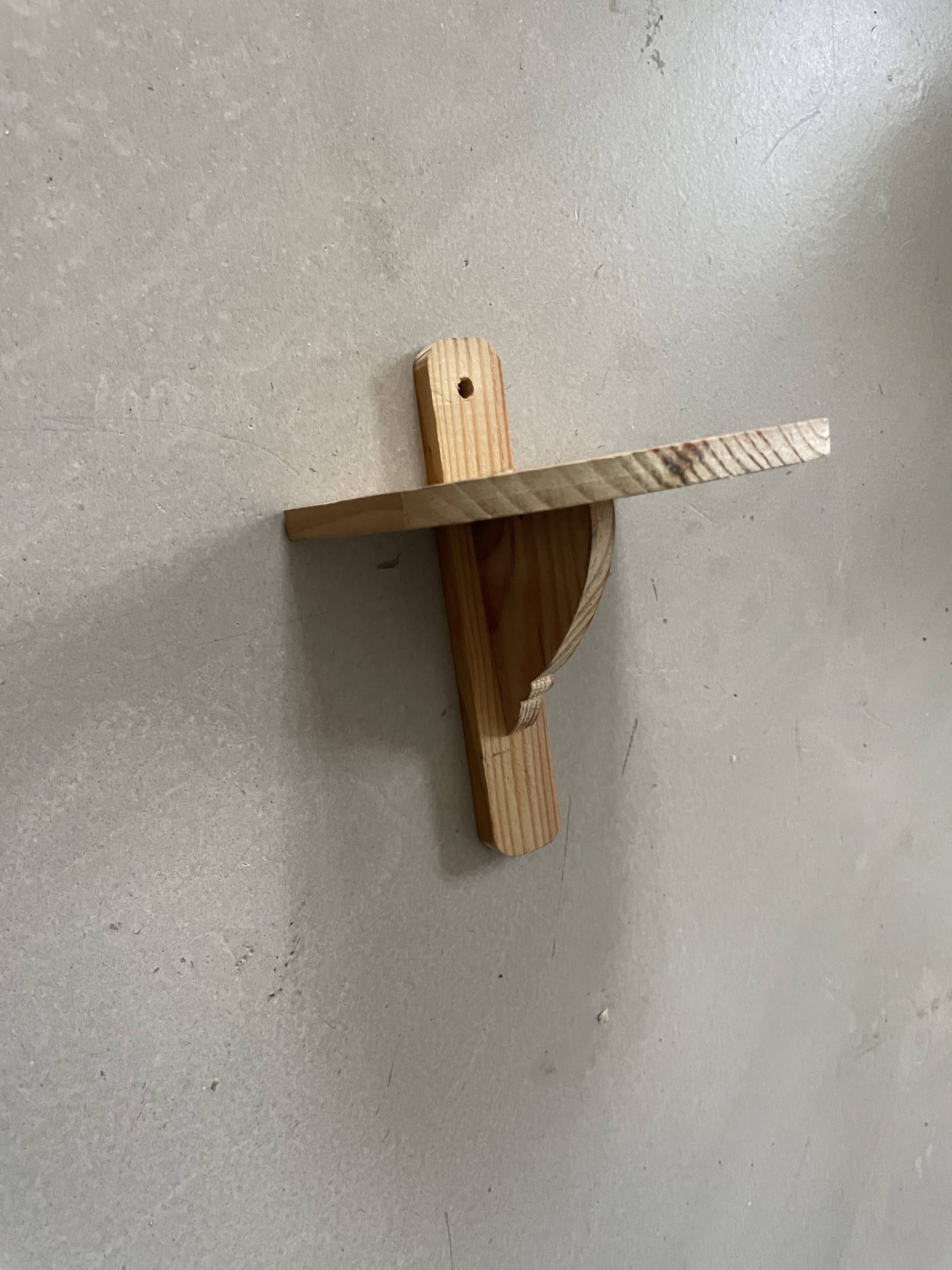 Small wall-mounted wooden shelf