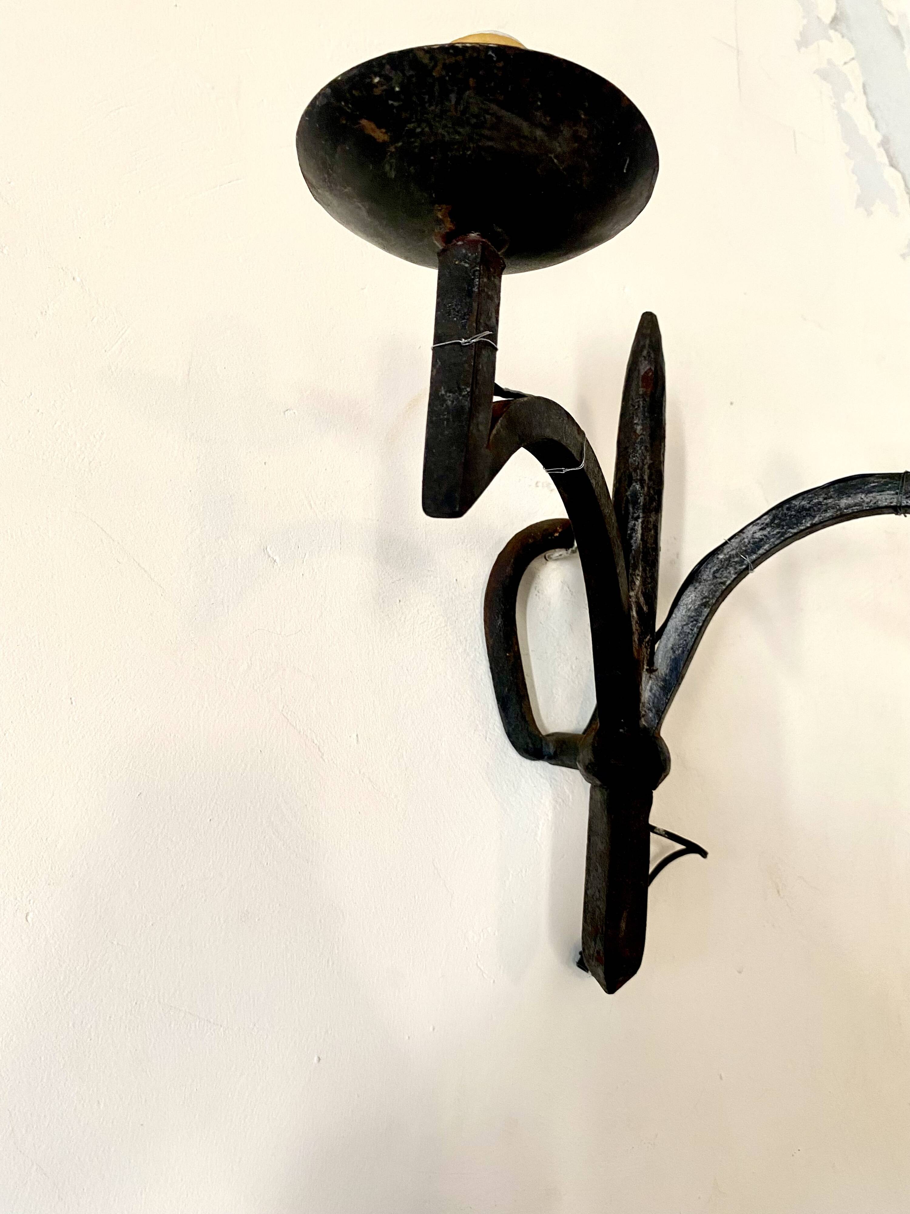 Wrought iron wall light with 2 lights