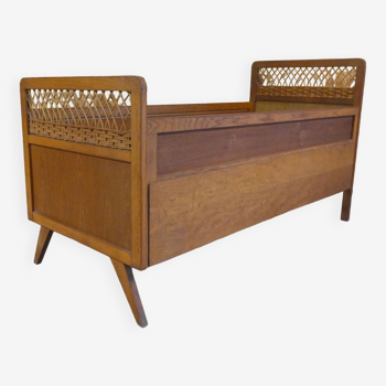 Vintage rattan and wood bed for children's compass feet