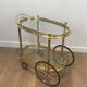 Oval brass trolley from Maison Baguès.