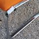 Pair of designer armchairs in orange fabrics and chrome tubes from the 70s