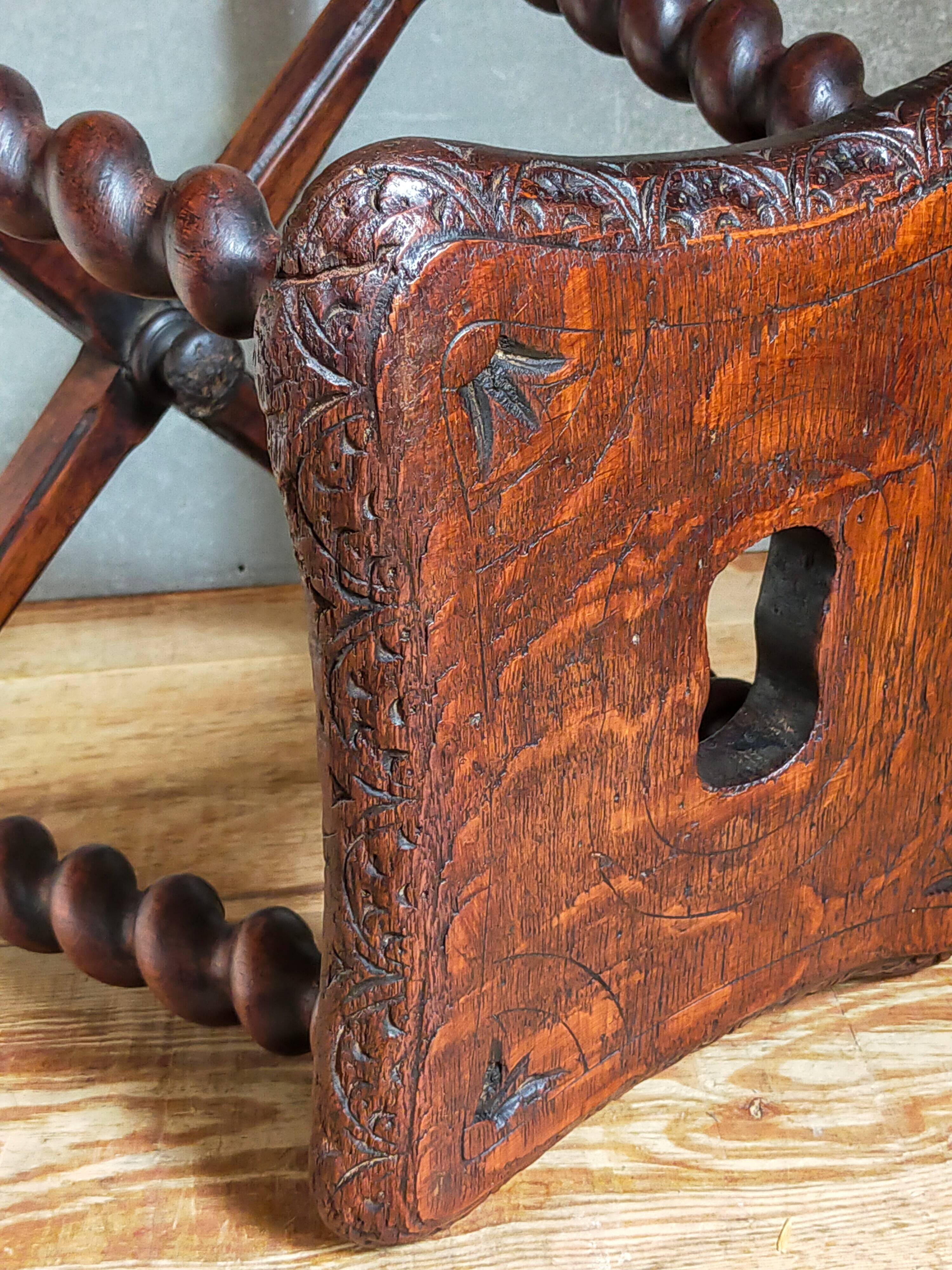 Antique stool in turned and carved solid wood
