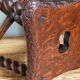 Antique stool in turned and carved solid wood