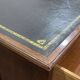 Large English flat desk in mahogany with leather top, early 20th century