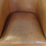 Sheep leather club chair in neutral cognac colour and in good condition