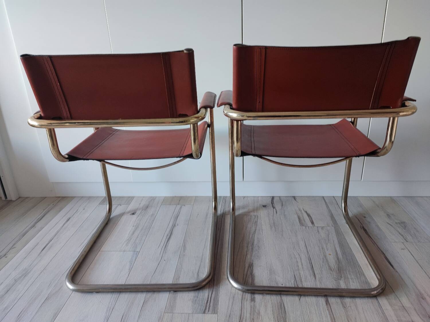 B34 armchairs, cognac leather and gilding