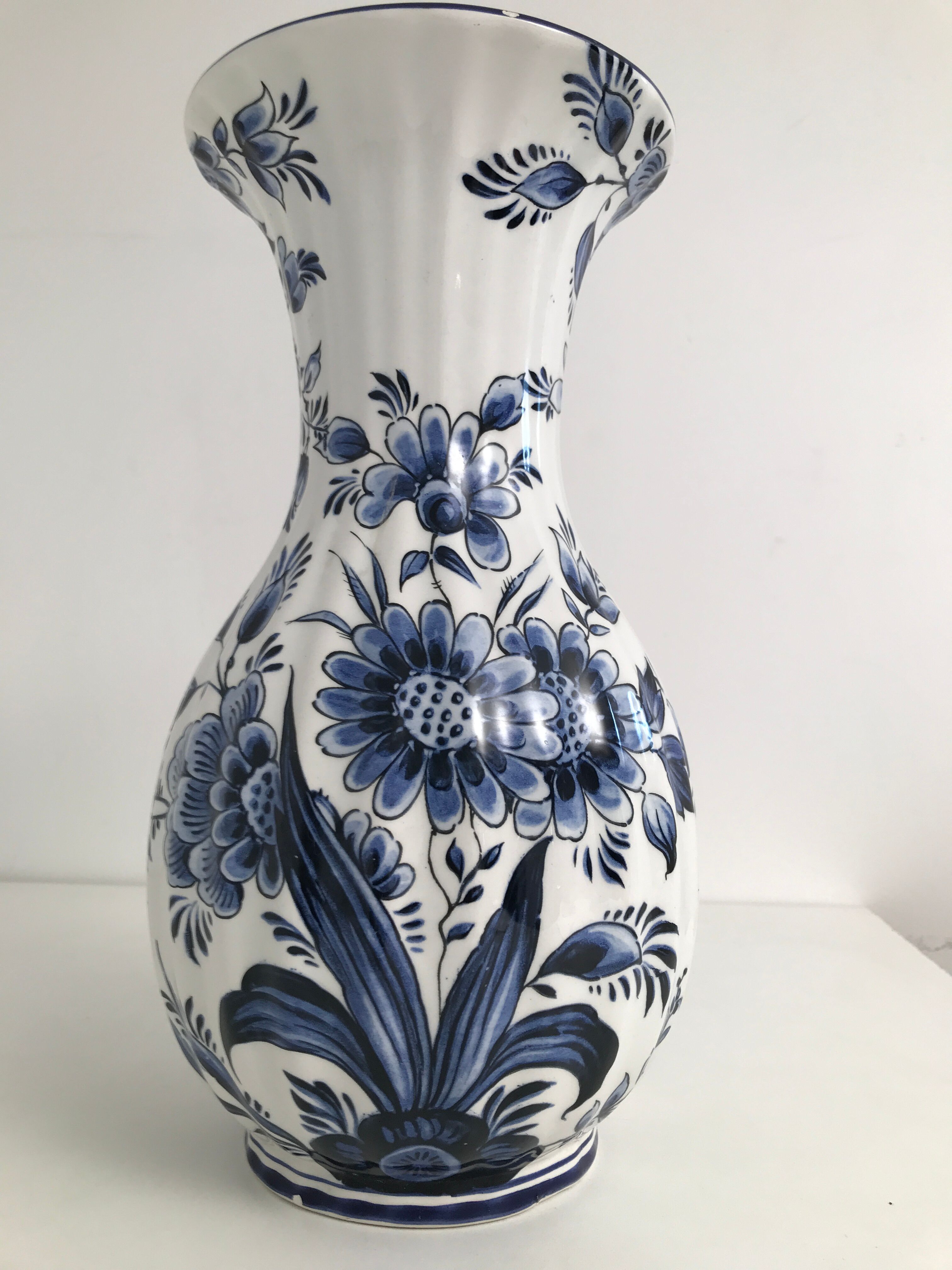 Vase with vintage blue and white flower pattern signed