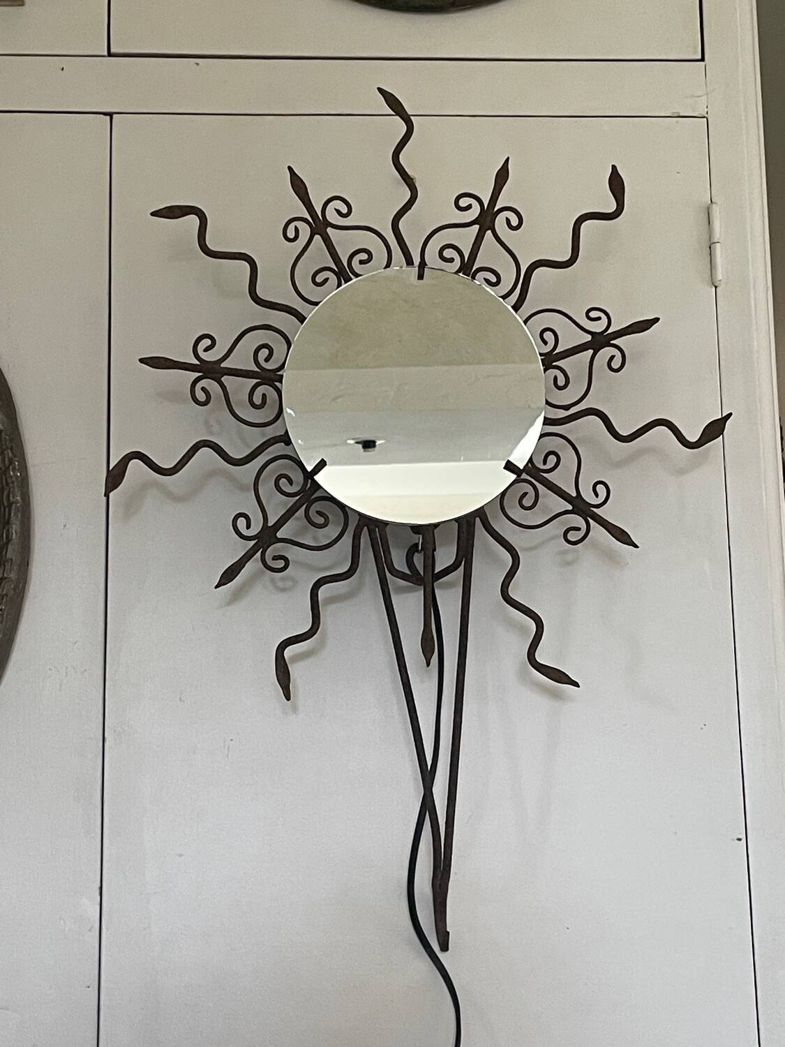 Luminous wrought iron sun mirror