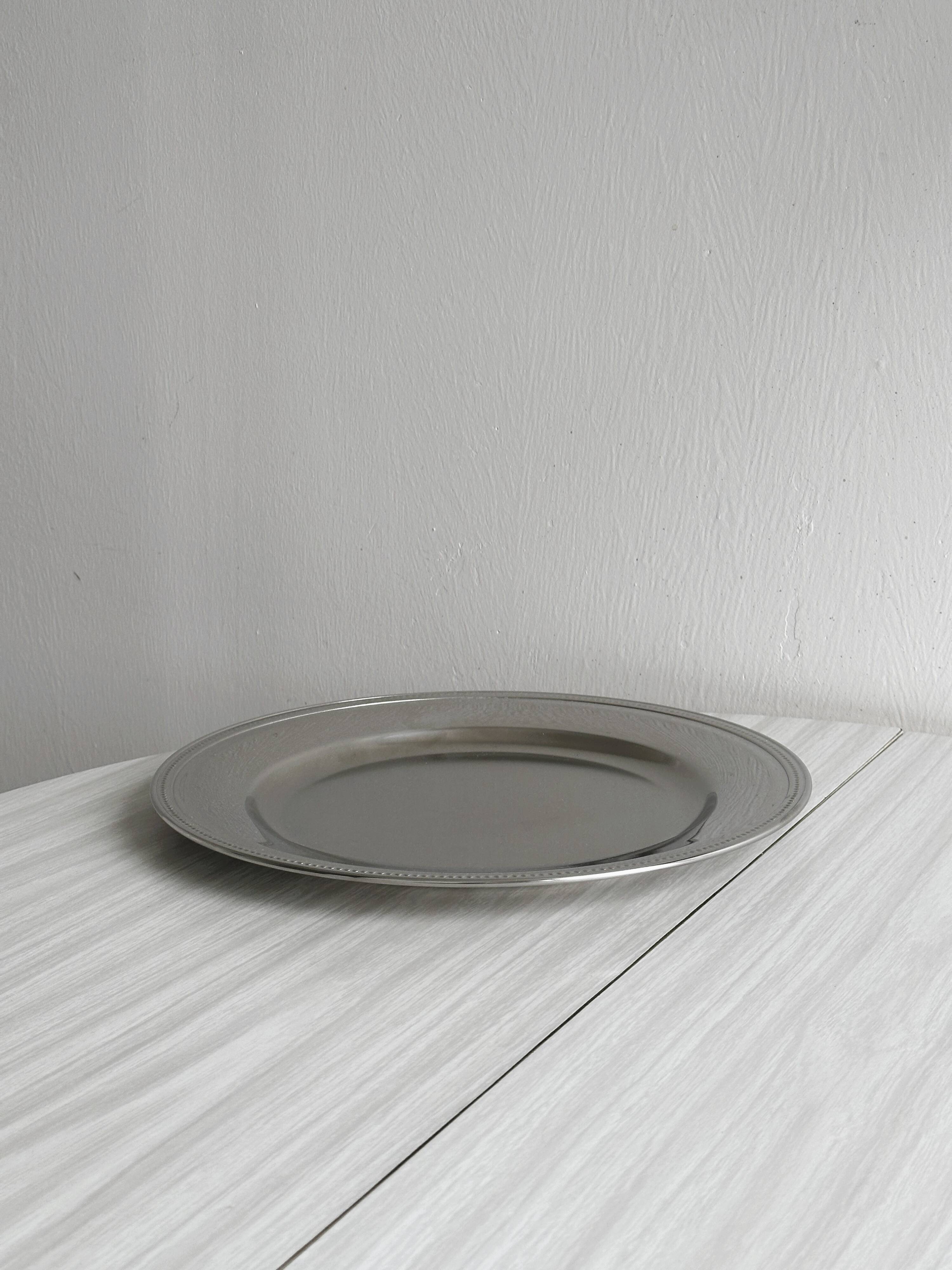 Large shiny stainless steel tray