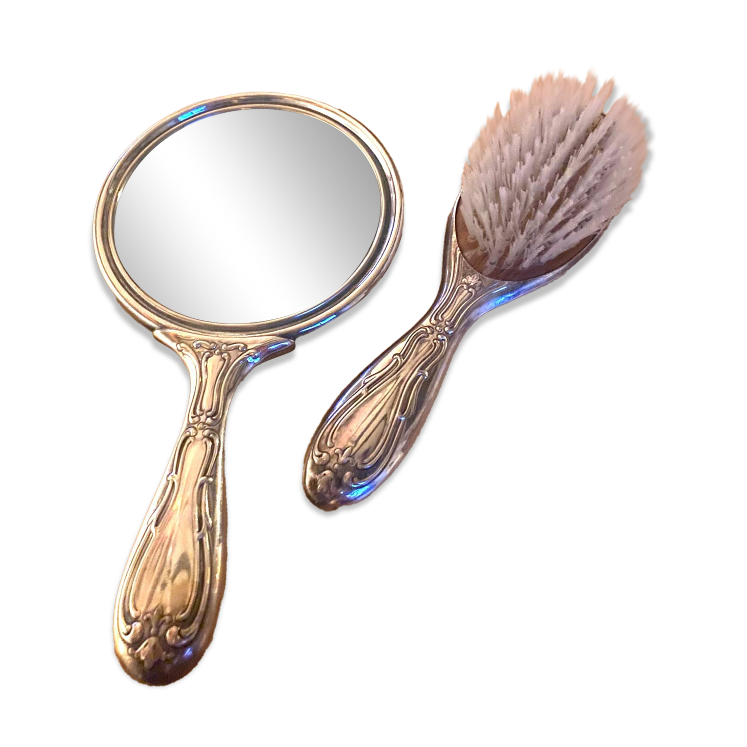 Silver metal hand mirror and laundry brush