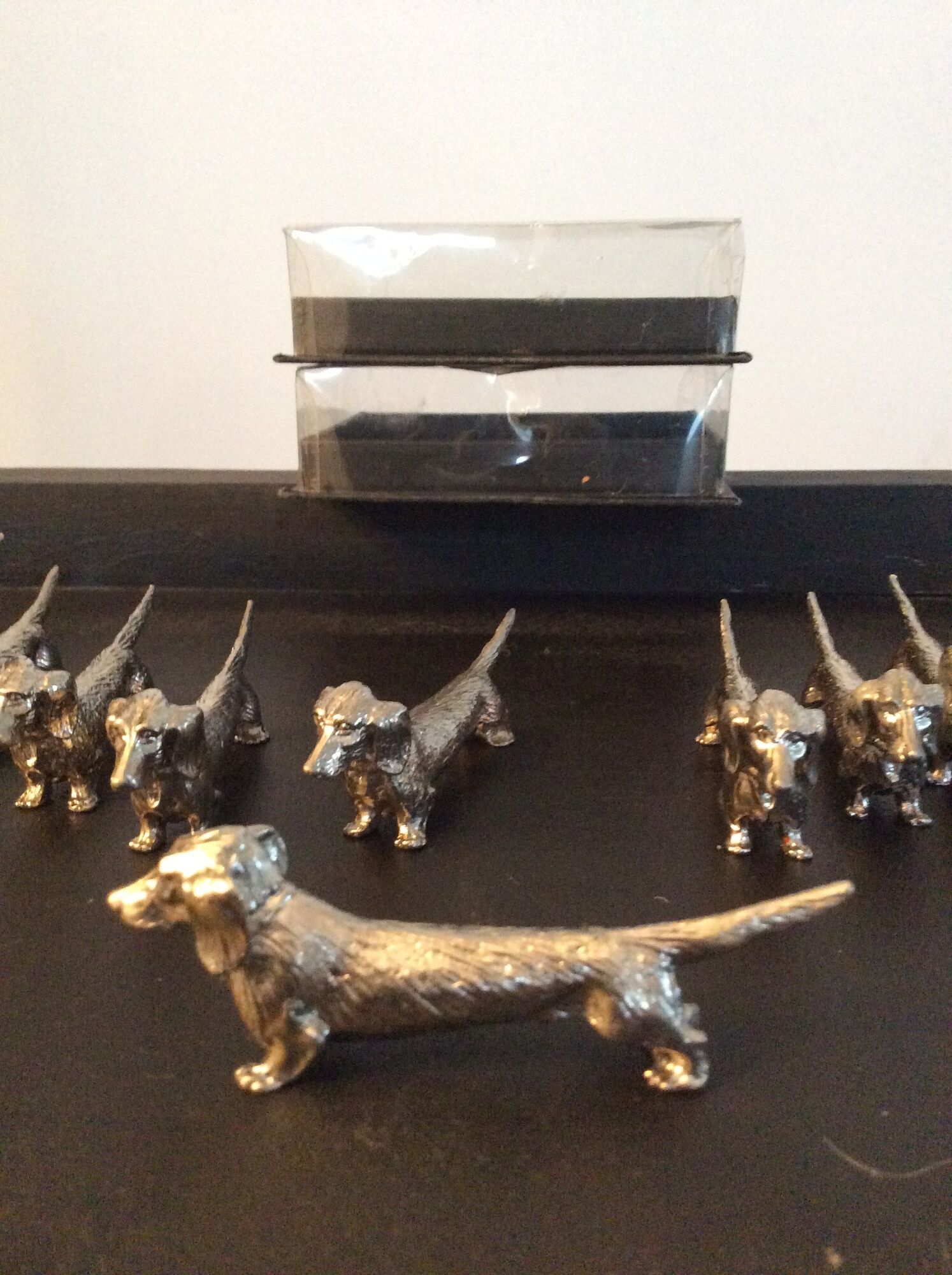 Series of 12 vintage dachshund knife holders in silver metal