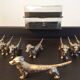 Series of 12 vintage dachshund knife holders in silver metal