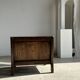 Small low armchair in varnished brown wood