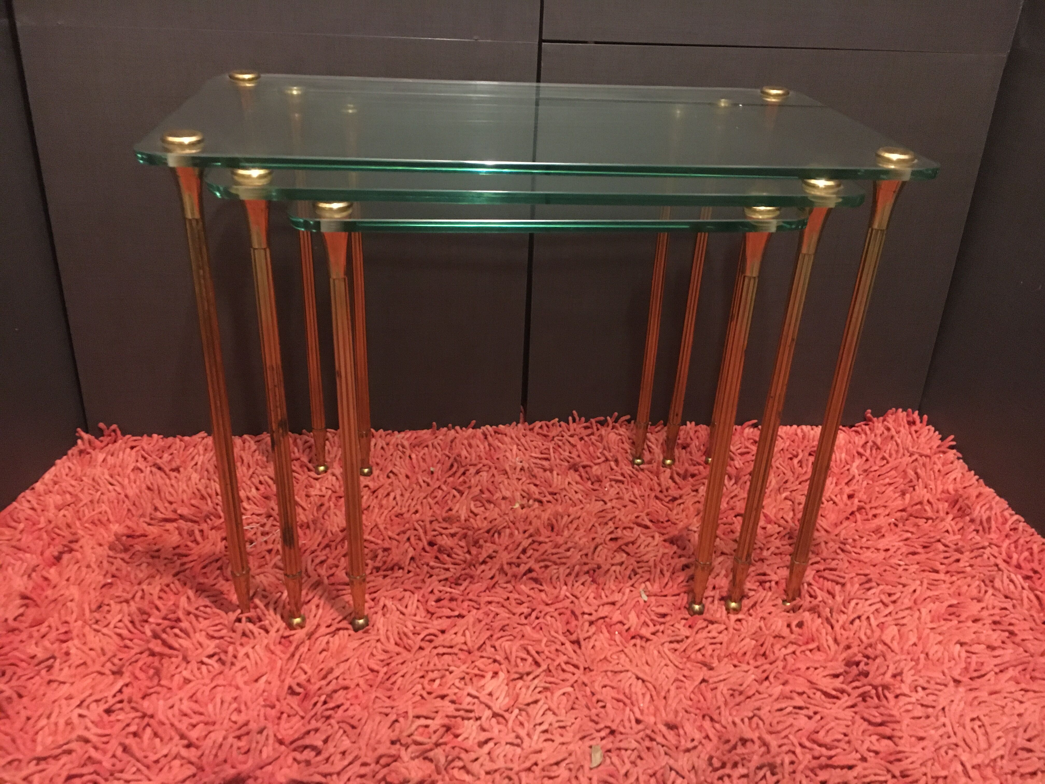 Brass and glass trundle tables