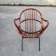 Rattan shell armchair with metal feet
