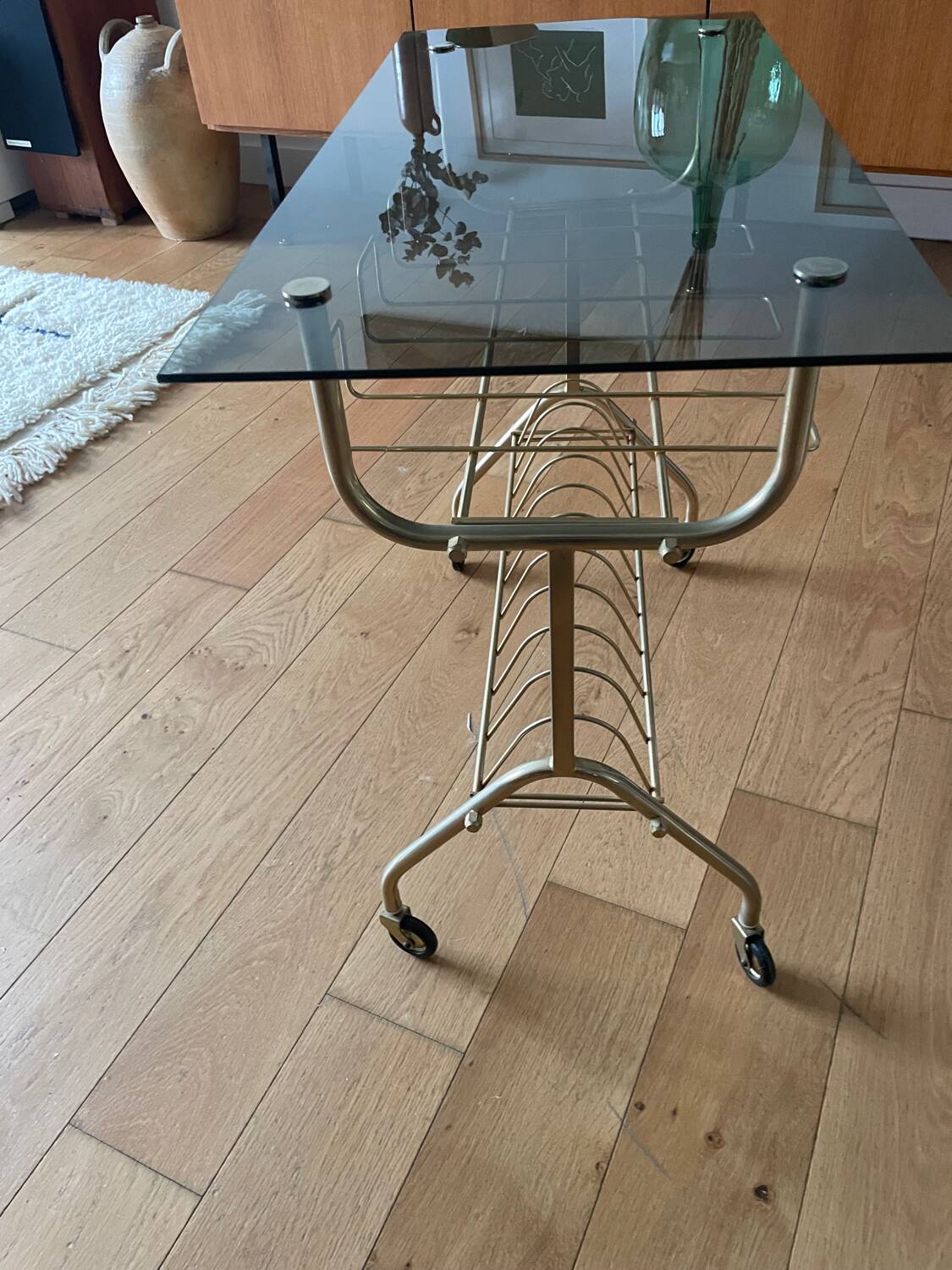 Green and brass trolley on wheels