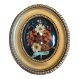 Oval frame with gold patina dried flowers