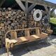 Baumann bench with wooden frame and faux leather seat.