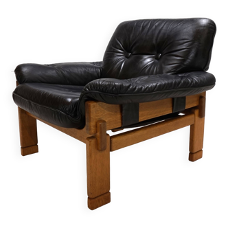 Fauteuil brutaliste cuir et chêne, 1960