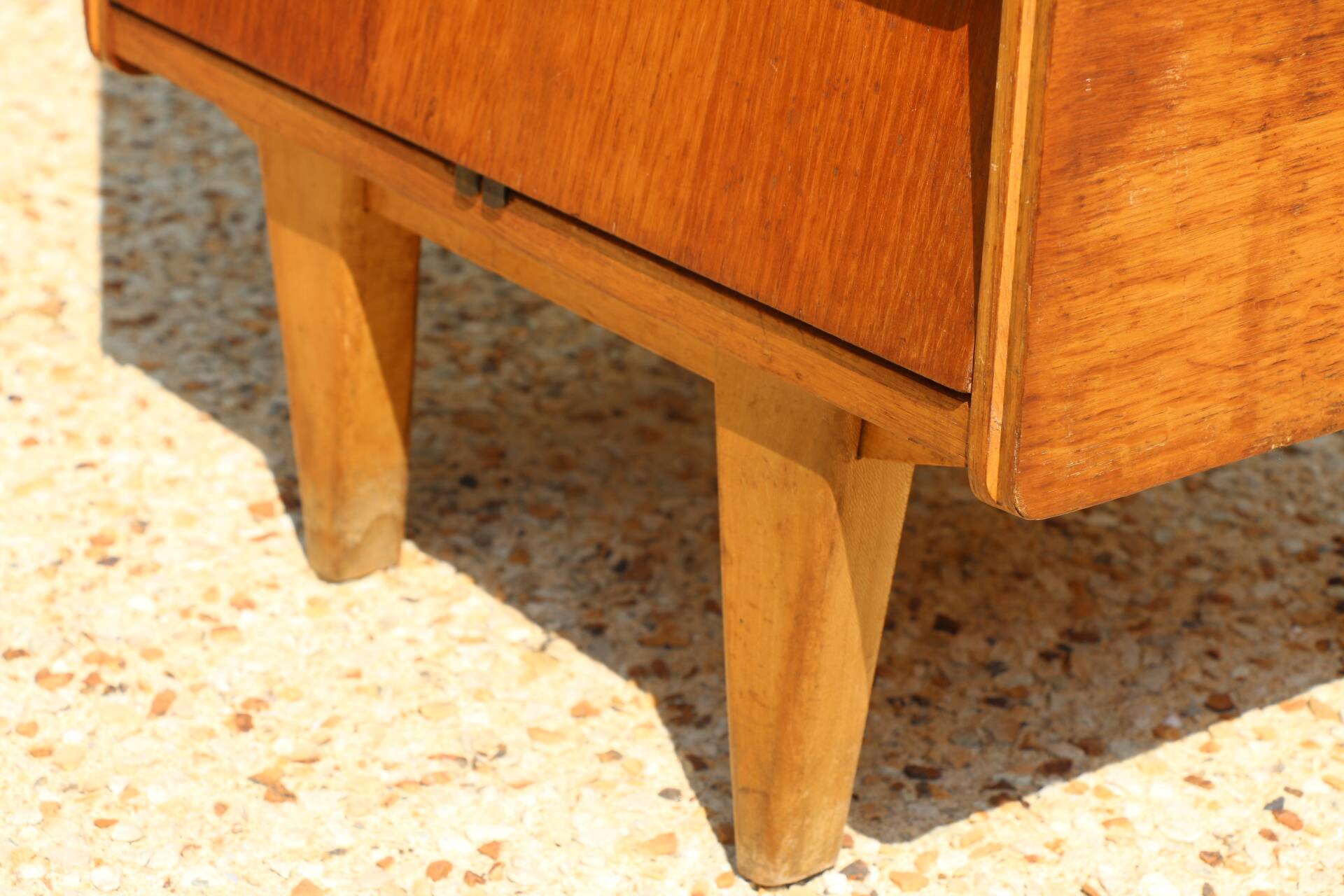Dark chest of drawers with 5 drawers from the 1950s