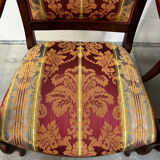 Pair of cross-back armchairs, Empire style, 19th century.