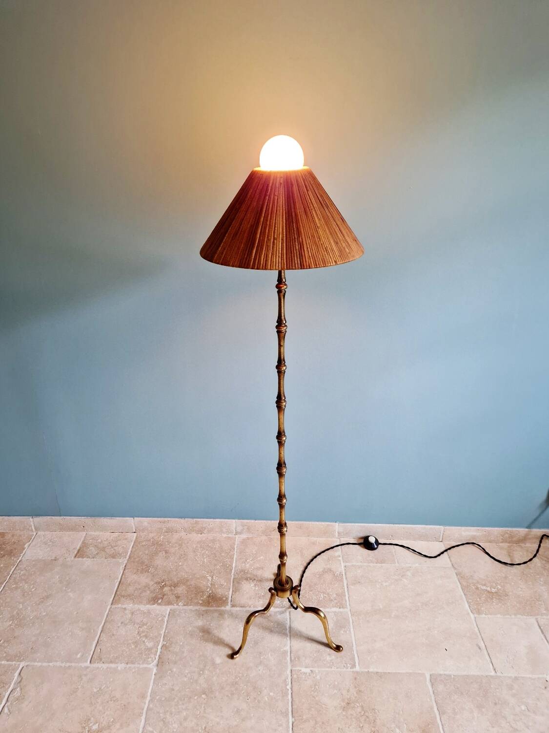 Brass floor lamp with rattan shade, 1950s-60s.