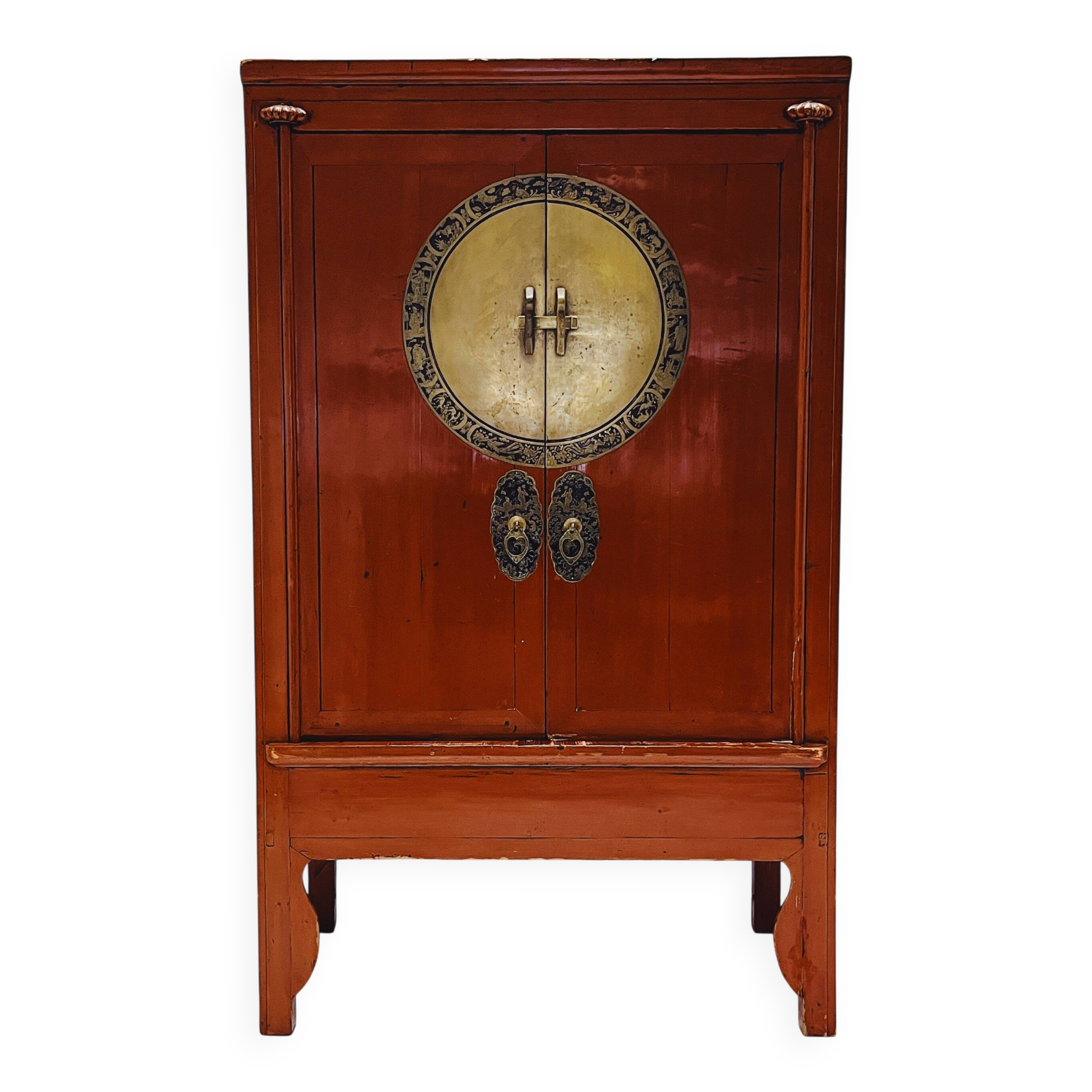 Antique red cabinet with brass details
