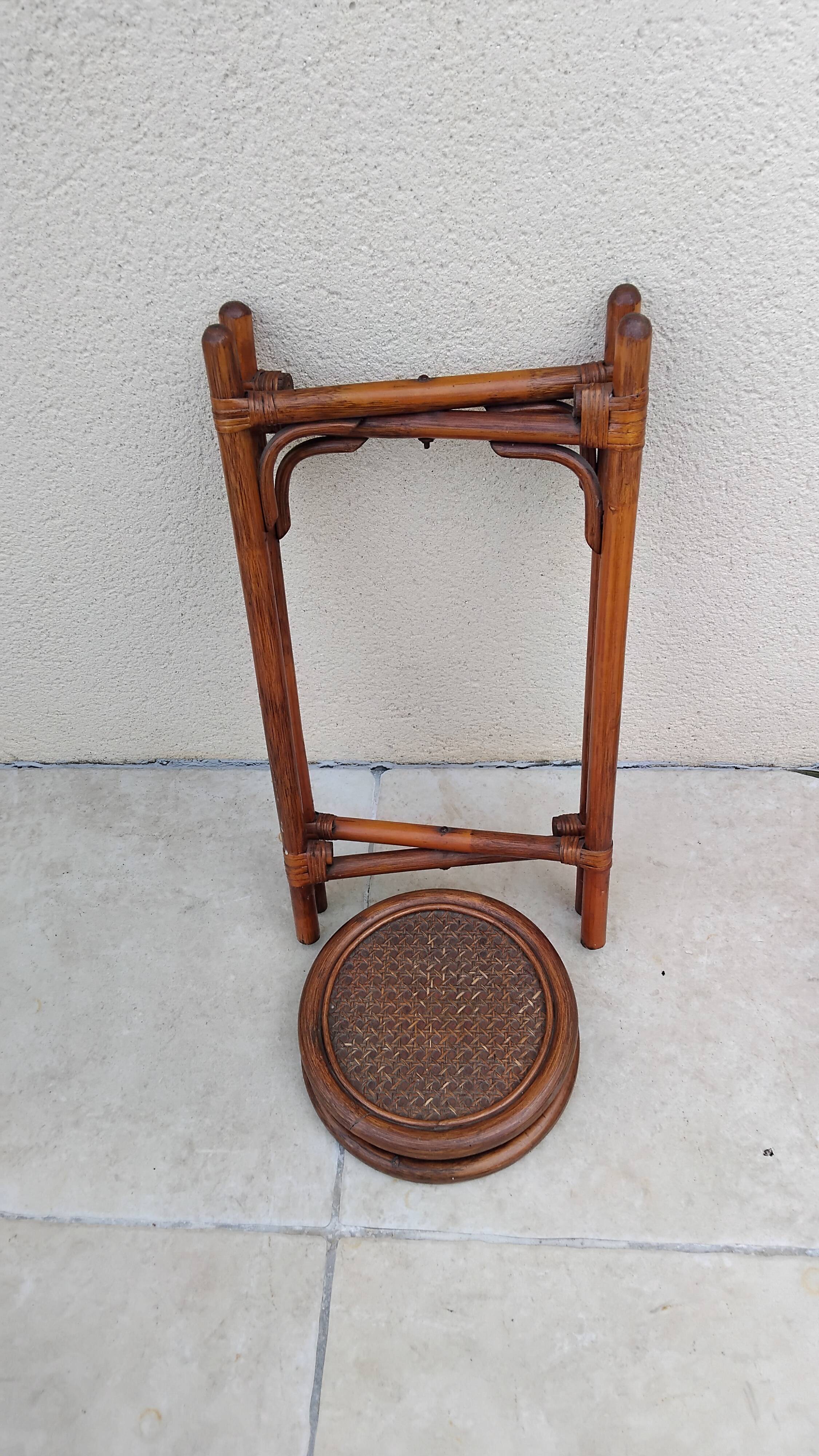 Vintage folding wooden and wicker side table.