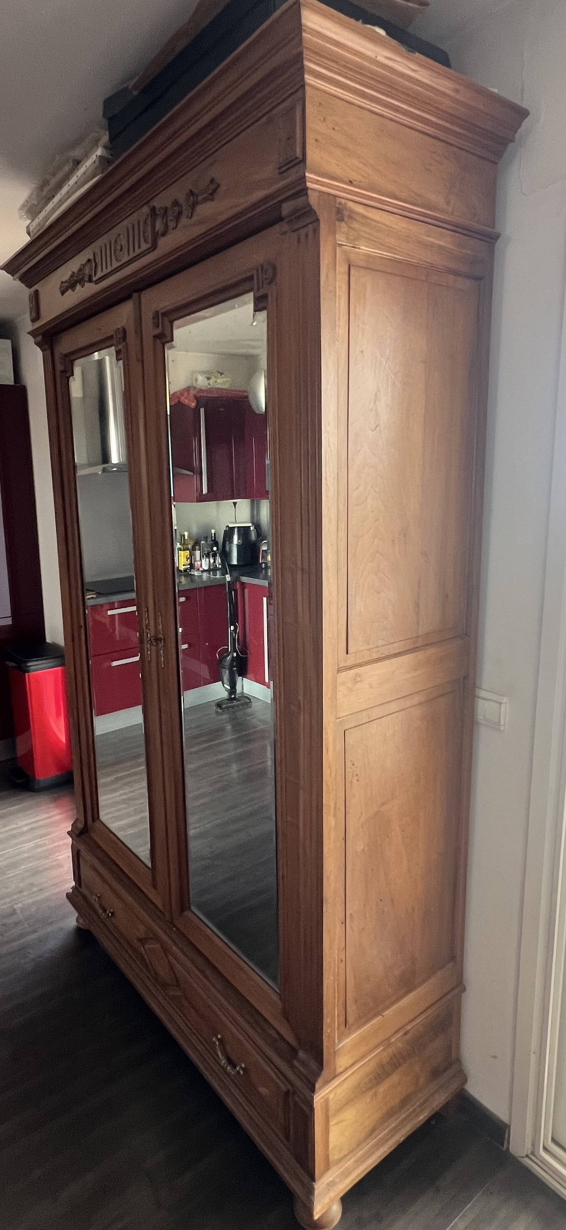 Walnut wardrobe with mirror doors.