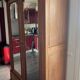 Walnut wardrobe with mirror doors.