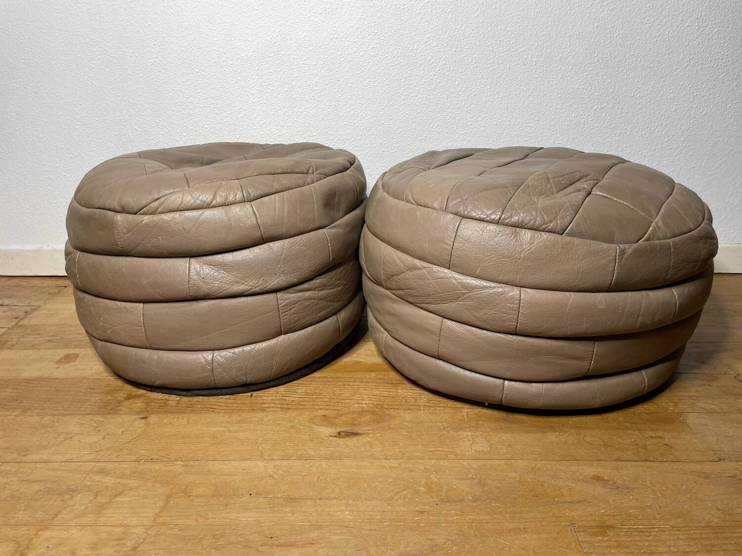 Pair of De Sède patchwork leather poufs