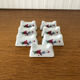 7 portes couteaux vintage en porcelaine décor floral