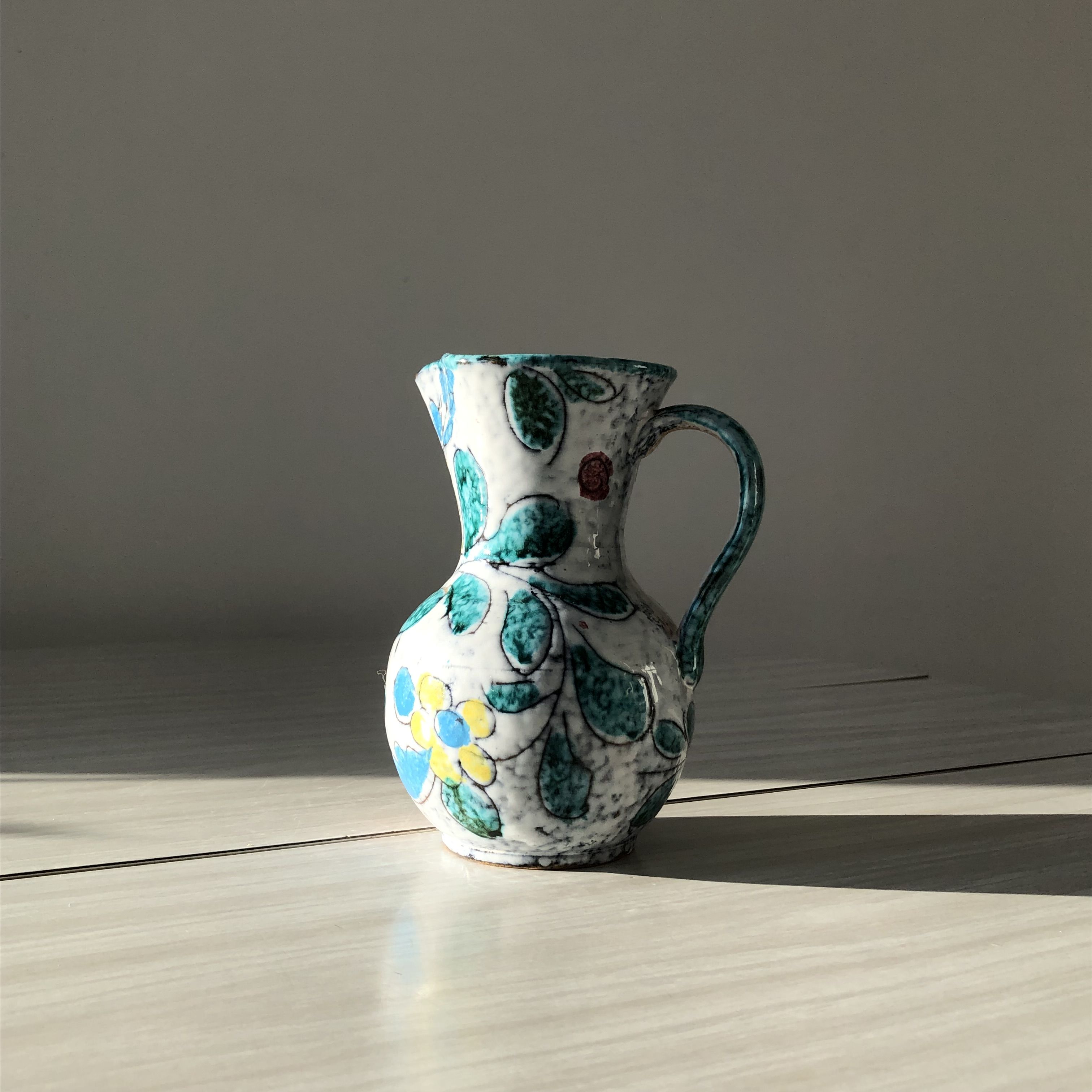 Ceramic vase pitcher with handles. Floral decoration, made in Italy.