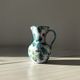 Ceramic vase pitcher with handles. Floral decoration, made in Italy.