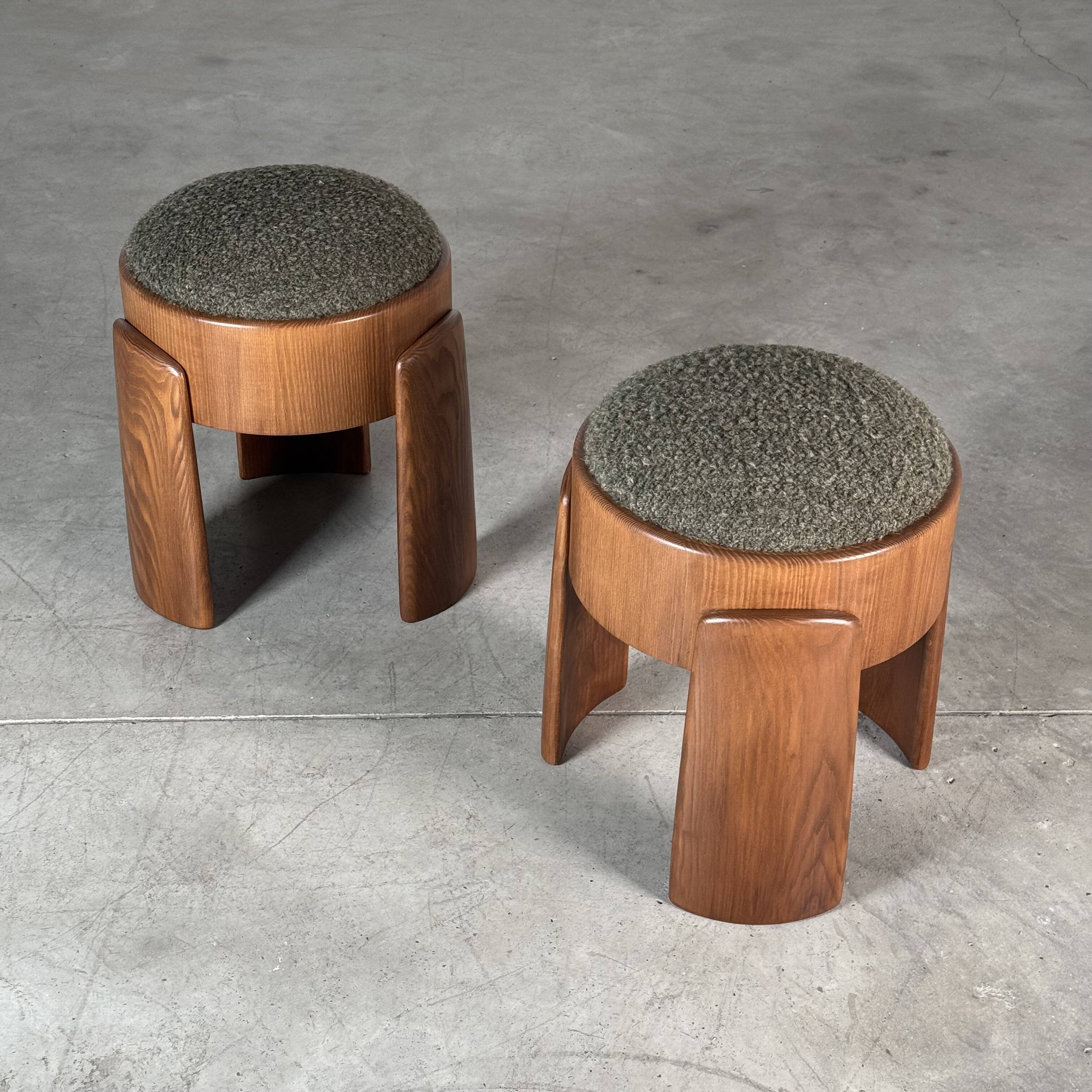 Sculptural pair of ash wood stools with dedar milano bouclé
