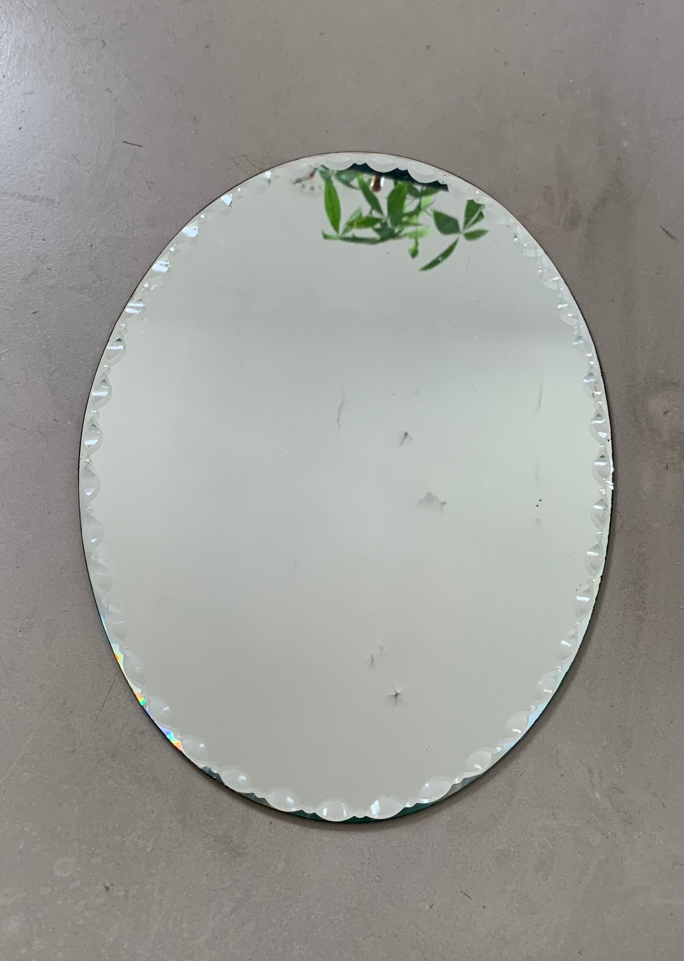 Old beveled oval mirror