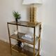 VINTAGE SHELF CONSOLE IN GOLD METAL AND SMOKED GLASS
