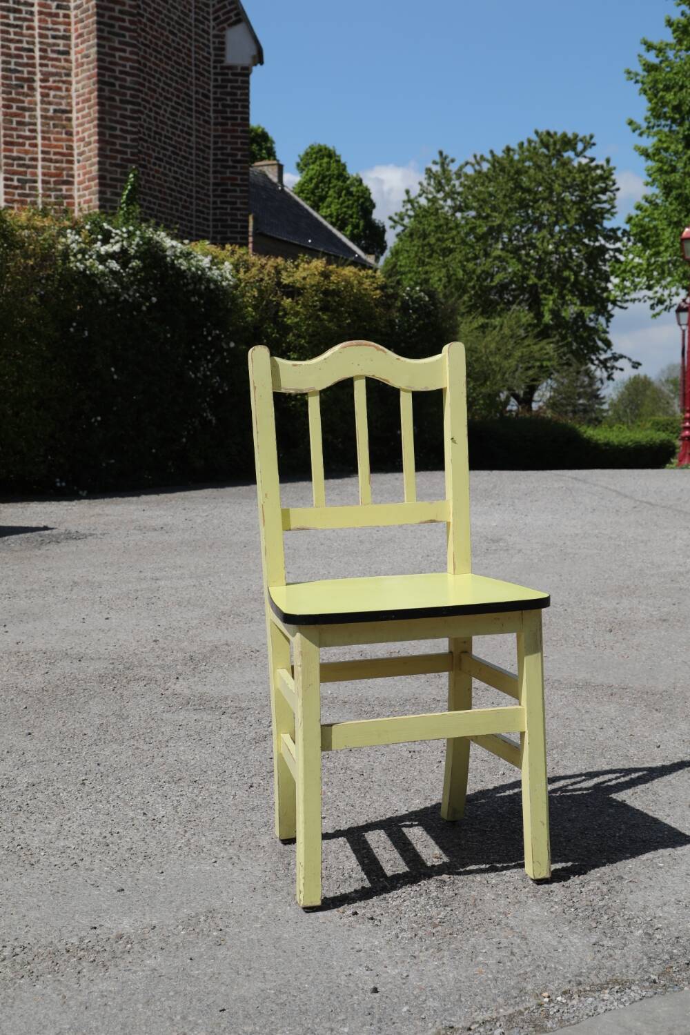 Formica and yellow wood chair